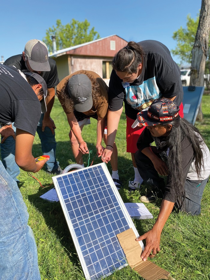 The Tribal Train-the-Trainer course has participants from many tribal nations who stay onsite at Red CloudRenewable for four weeks. Here, participants study and build a solar water-pumping system that is helpful in gardens and for livestock.