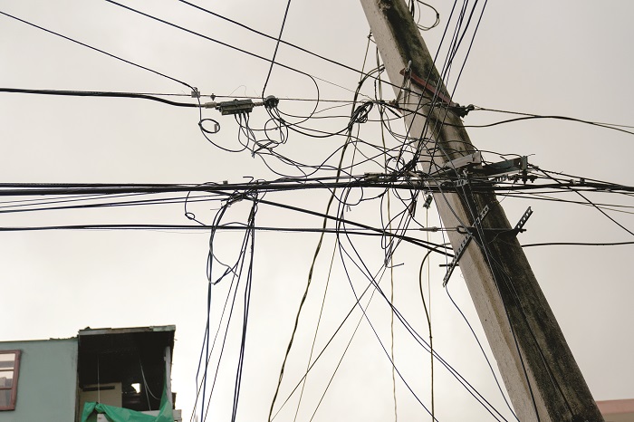 There are tangled power lines on this utility pole in Puerto Rico.