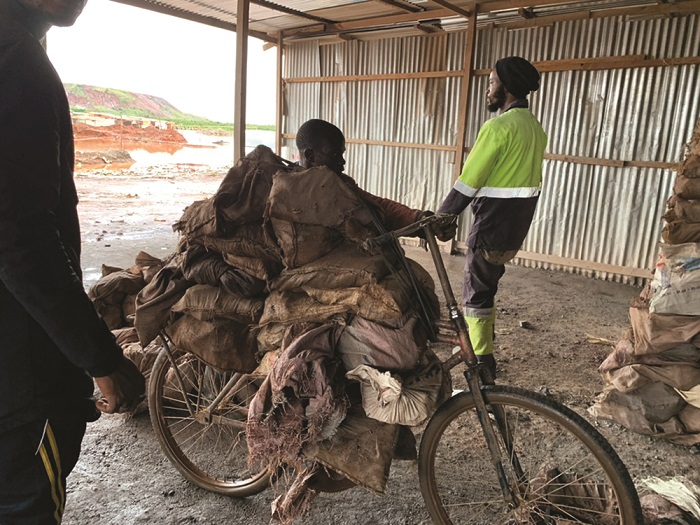 This man transported sorted cobalt by bicycle to the nearest depot for sale.