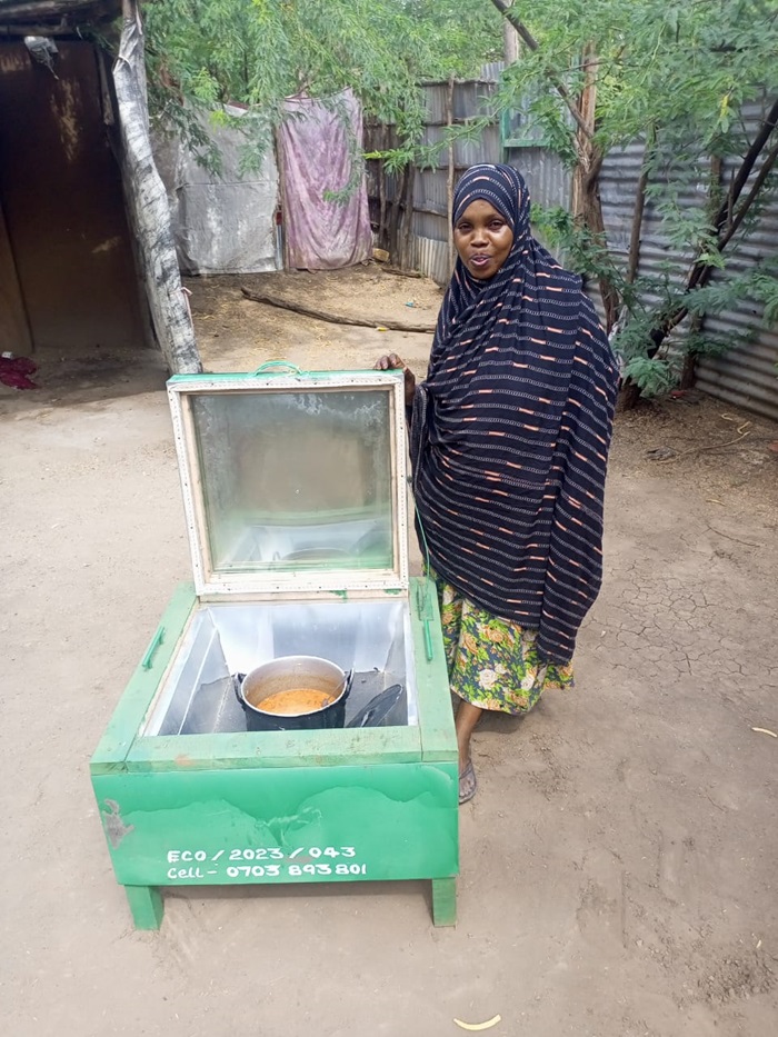 A program participant cooked beans in her ULOG Solar Box Oven.