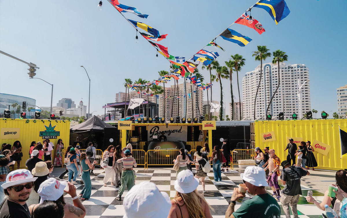 People dancing and listening to music at a stage at the Cali Vibes Music Festival