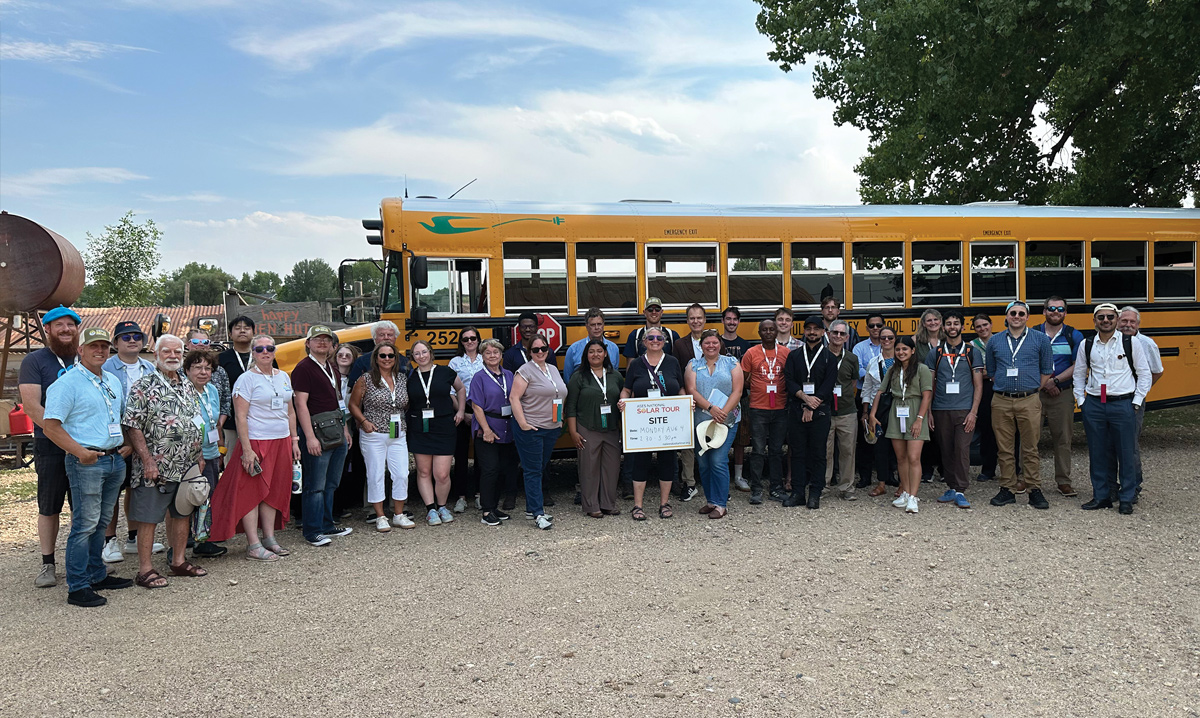 A group of conference attendees touring Jack’s Solar Garden as part of the Local Boulder Solar Tour.