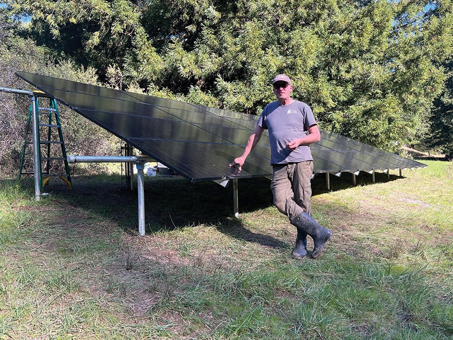Bob Frank with his completed ground-mounted solar array.