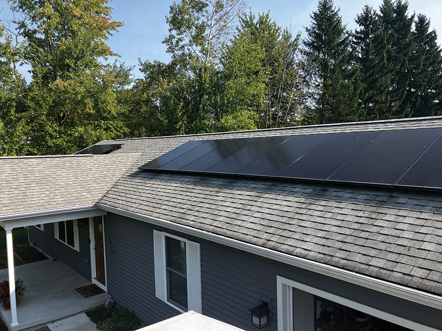 Kim Bloxom’s completed rooftop solar array. The project reflects the guided DIY model: capable homeowners taking an active role in their solar installation while relying on professional design, plans, and technical support.